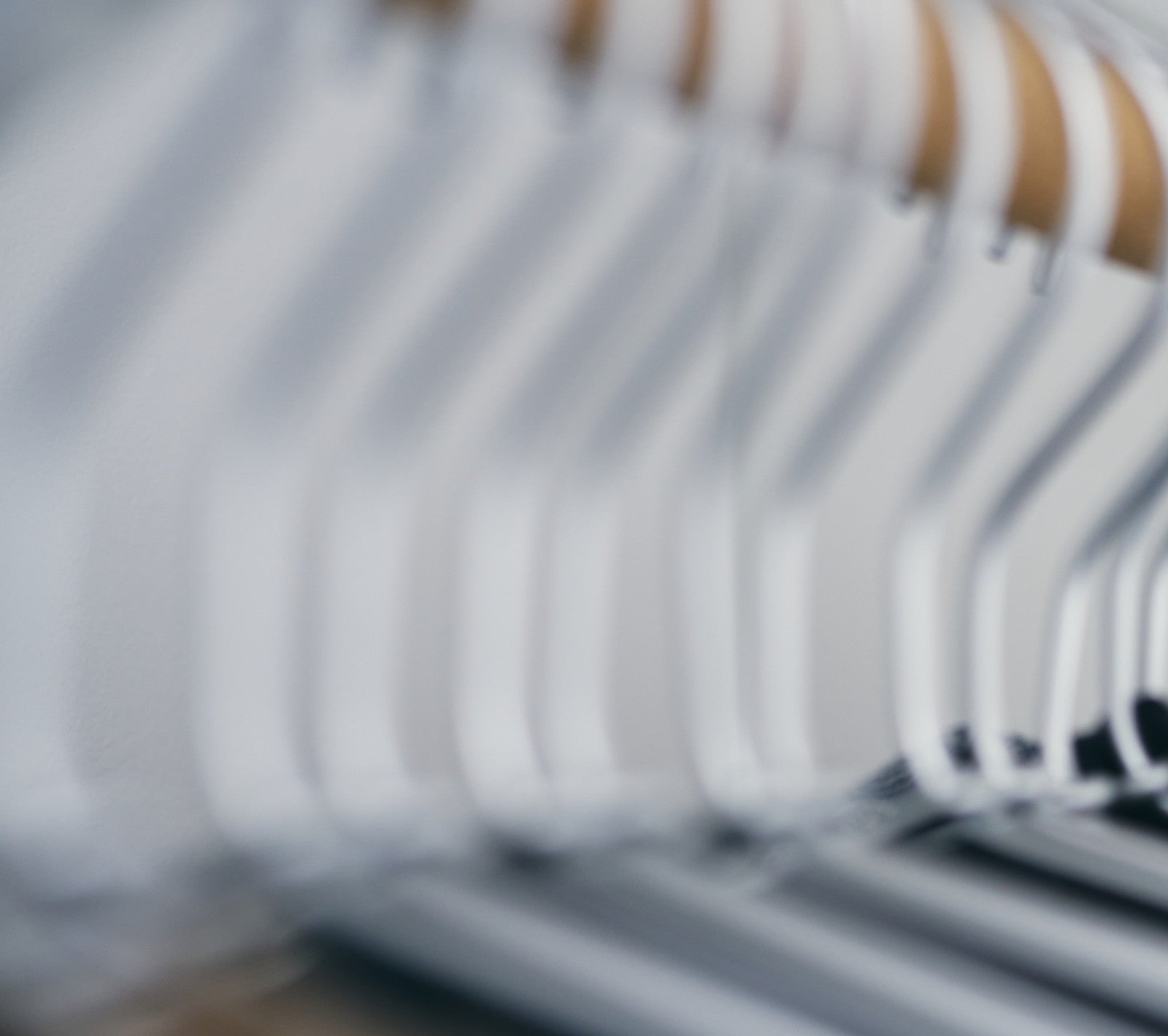 Freshly cleaned garments hanging after professional dry cleaning service in Melbourne