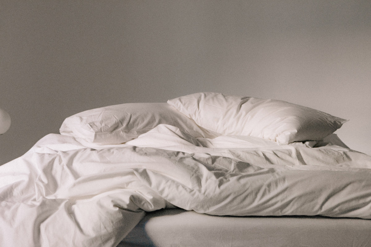 Freshly cleaned white doona and pillows after professional doona cleaning service in Melbourne.