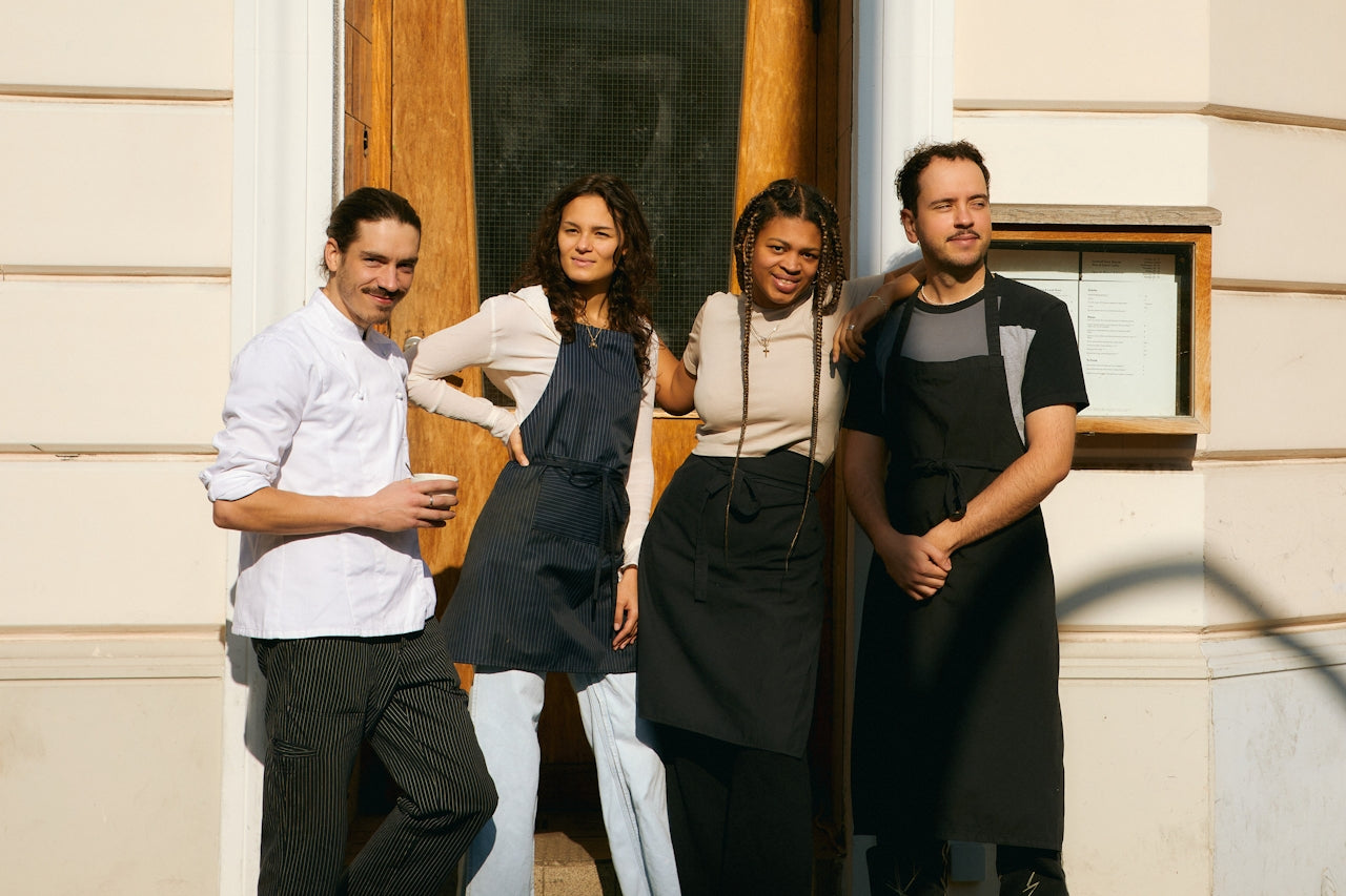Hospitality team wearing freshly cleaned uniforms provided by a professional laundry service in Melbourne